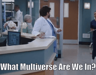 A Man In A Lab Coat Stands At A Counter In A Hospital With The Words " What Multiverse Are We In " Below Him GIF