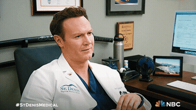 A Man In A Lab Coat That Says St Denis Medical GIF