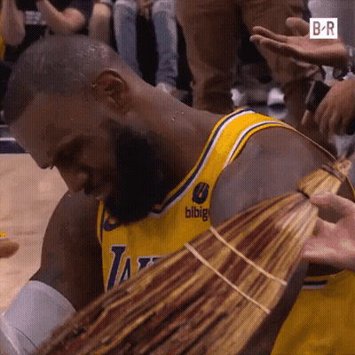 A Man In A Lakers Jersey Is Holding A Bunch Of Money In His Hands GIF