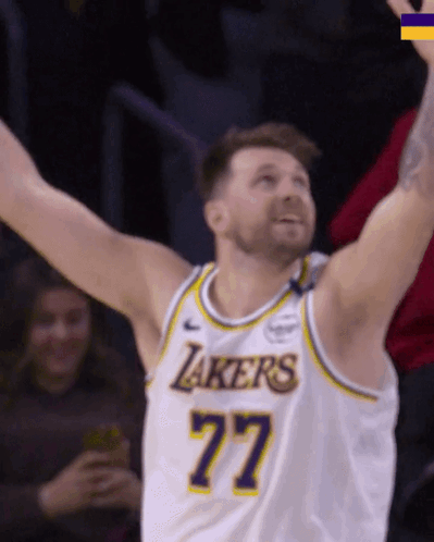 A Man In A Lakers Jersey With The Number 77 GIF