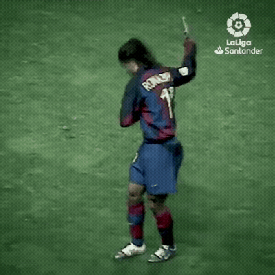 A Man In A Laliga Santander Jersey Is Walking On A Field . GIF