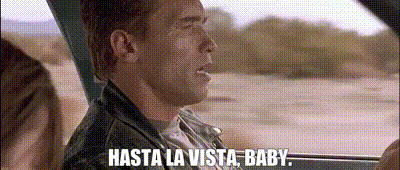 A Man In A Leather Jacket Is Driving A Car And Saying `` Hasta La Vista , Baby '' . GIF