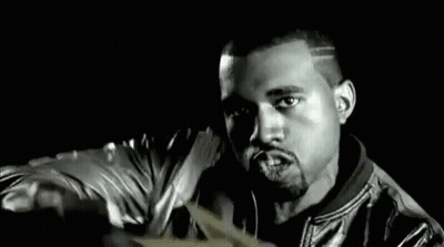 A Man In A Leather Jacket Is Holding A Bunch Of Money In His Hands . GIF
