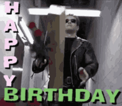 A Man In A Leather Jacket Is Holding A Cardboard Box With The Words Happy Birthday On It GIF