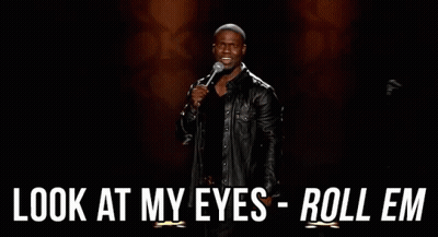 A Man In A Leather Jacket Is Holding A Microphone And Saying `` Look At My Eyes Roll Em '' . GIF