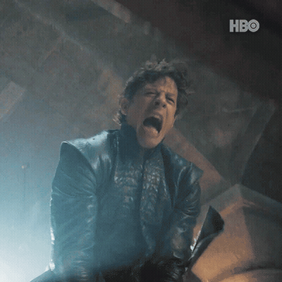 A Man In A Leather Jacket Is Screaming And Holding A Sword With The Hbo Logo In The Background GIF