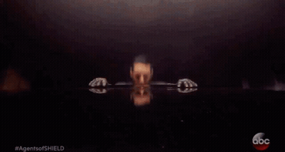 A Man In A Leather Jacket Is Sitting At A Table With The Abc Logo On The Bottom GIF