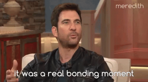 Man In Leather Jacket Talking To Woman On TV Show GIF