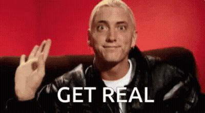 A Man In A Leather Jacket Is Sitting On A Couch With The Words Get Real Written On The Bottom Of His Face . GIF