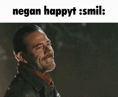 A Man In A Leather Jacket Is Smiling With The Words Negan Happyt Smil GIF