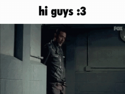 A Man In A Leather Jacket Is Standing In A Doorway With The Words Hi Guys 3 Above Him GIF