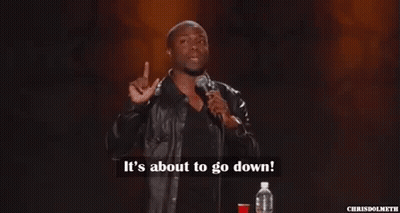 A Man In A Leather Jacket Is Standing In Front Of A Microphone . GIF