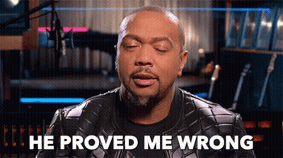 A Man In A Leather Jacket Says He Proved Me Wrong In Front Of A Microphone . GIF