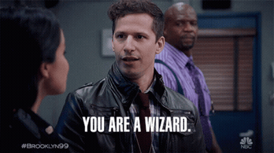 A Man In A Leather Jacket Says " You Are A Wizard " In Front Of A Woman GIF