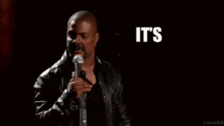 A Man In A Leather Jacket Stands In Front Of A Microphone And Says It 'S About To Go Down GIF