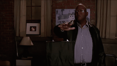 A Man In A Leather Jacket Stands In Front Of A Sign That Says Blessings On It GIF