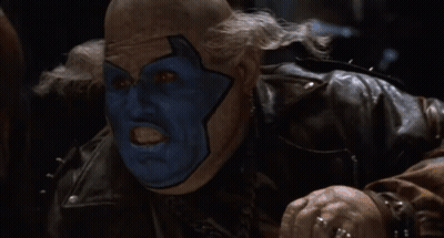 A Man In A Leather Jacket With The Words Ded Dead Behind Him GIF