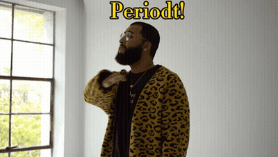 A Man In A Leopard Print Jacket Stands In Front Of A Window With The Word Periodt Written Above Him GIF