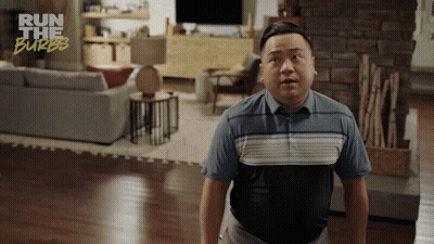 A Man In A Living Room With The Words Run The Burbs On The Bottom Right GIF