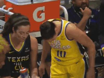 A Man In A Los Angeles Jersey Is Talking To A Woman In A Texas Jersey . GIF