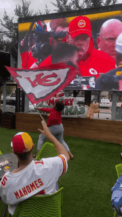 A Man In A Mahomes Jersey Watches A Game GIF