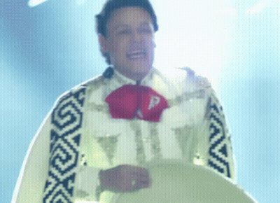 A Man In A Mariachi Outfit Has A Letter P On His Chest GIF