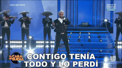 A Man In A Mariachi Outfit Sings Into A Microphone With The Words Contigo Tena Todo Y Lo Perdi Below Him GIF