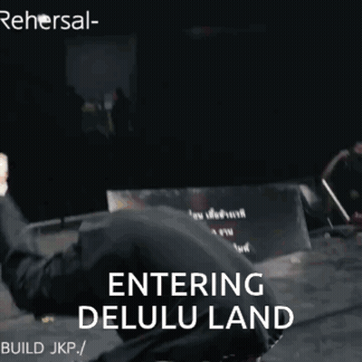 A Man In A Mask Is Doing A Trick With The Words Entering Delulu Land Behind Him GIF