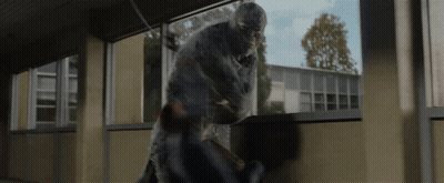 A Man In A Mask Is Fighting Another Man In A Room GIF