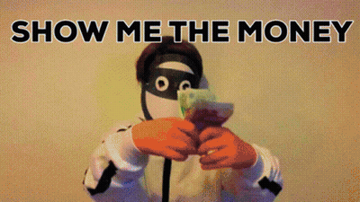 A Man In A Mask Is Holding A Bunch Of Money In Front Of His Face With The Words Show Me The Money Behind Him GIF