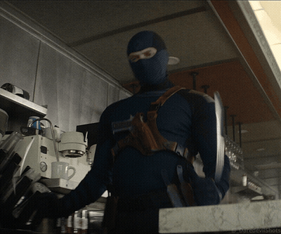 A Man In A Mask Is Standing In A Kitchen With The Words Daredevilshots Written On The Bottom GIF