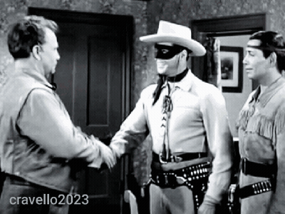 A Man In A Mask Shakes Hands With A Man In A Cowboy Hat In A Black And White Photo Taken By Cravello2023 GIF