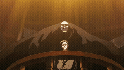 A Man In A Mask Stands In Front Of A Large Monster GIF