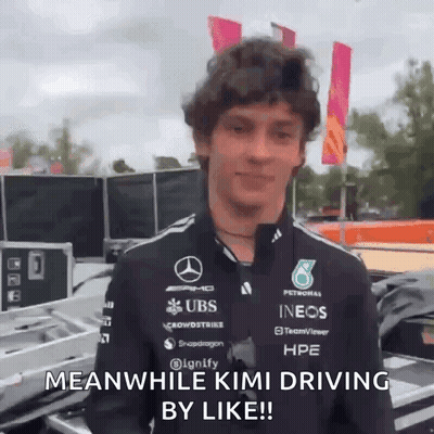 A Man In A Mercedes Shirt Says Meanwhile Kimi Driving By Like . GIF