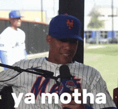 A Man In A Mets Jersey Is Talking Into A Microphone With Ya Motha Written On The Bottom GIF
