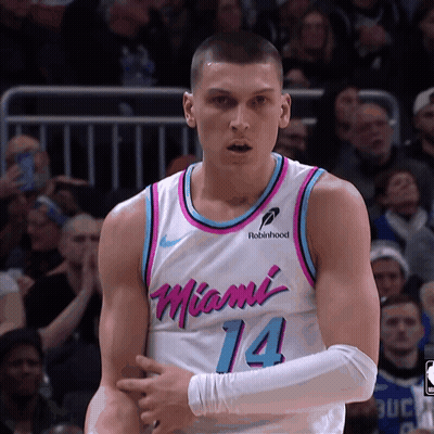 A Man In A Miami 14 Jersey Stands On The Court GIF