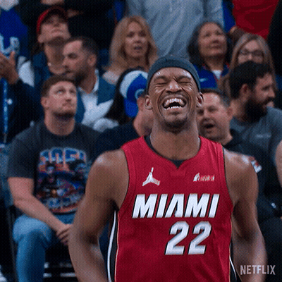 A Man In A Miami 22 Jersey Is Laughing GIF