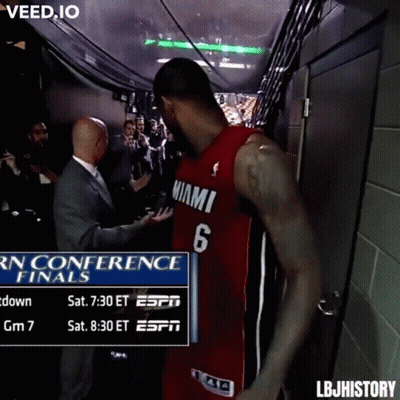 A Man In A Miami Jersey Is Standing In A Hallway GIF