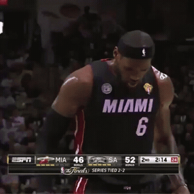 A Man In A Miami Jersey Stands In Front Of A Crowd During A Game GIF