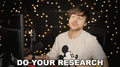 A Man In A Mickey Mouse T-Shirt Says Do Your Research GIF