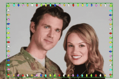 A Man In A Military Uniform And A Woman In A Black Turtleneck Pose For A Picture GIF