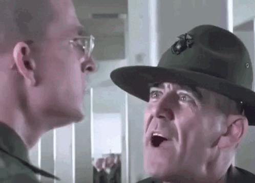 A Man In A Military Uniform And Hat Is Talking To Another Man In A Military Uniform And Hat . GIF