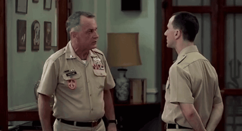 A Man In A Military Uniform Has A Patch On His Chest That Says ' U.s. Marine Corps ' GIF