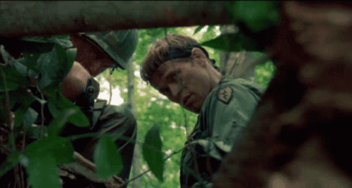 A Man In A Military Uniform Has A Patch On His Chest That Says ' Us Army ' GIF