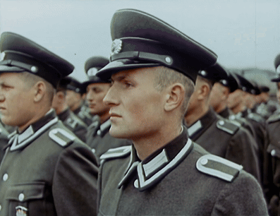A Man In A Military Uniform Has The Letter C On His Shoulder Strap GIF