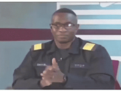 A Man In A Military Uniform Is Clapping His Hands GIF