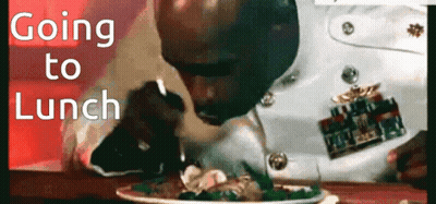 A Man In A Military Uniform Is Eating A Plate Of Food With The Words " Going To Lunch " Above Him GIF