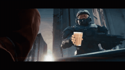 A Man In A Military Uniform Is Holding A Glass Of Milk GIF