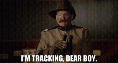 A Man In A Military Uniform Is Holding A Gun And Says `` I 'M Tracking , Dear Boy '' . GIF