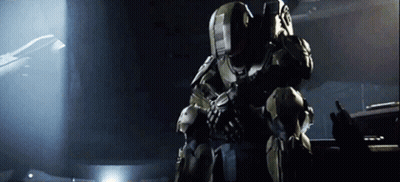 A Man In A Military Uniform Is Holding A Gun And Talking On A Radio GIF